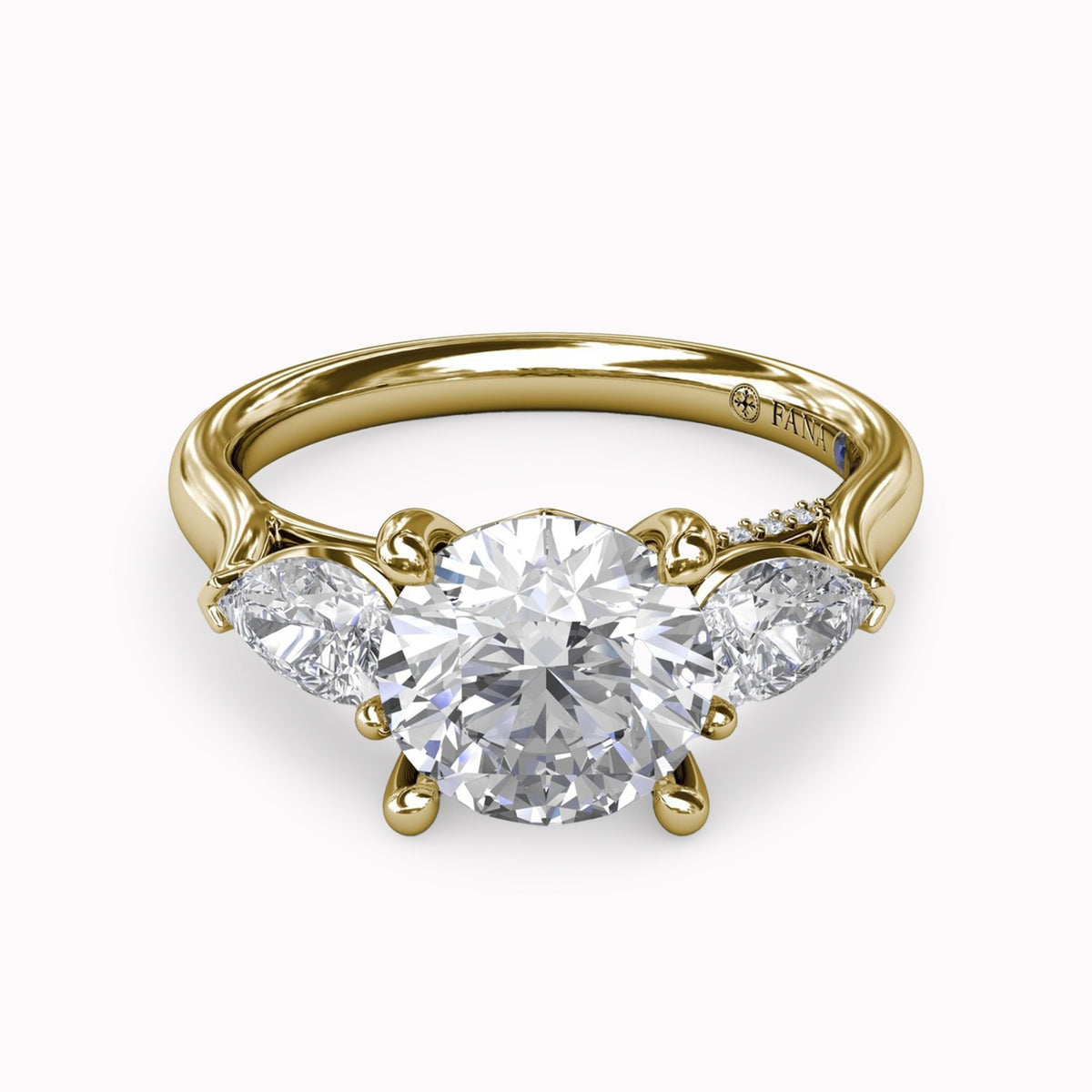 Three-Stone Ring With Pear Side Stones & Arch Halo Engagement Setting